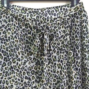 Nwt lili sidonio small ruffled skirt in a green, black and gold animal print.